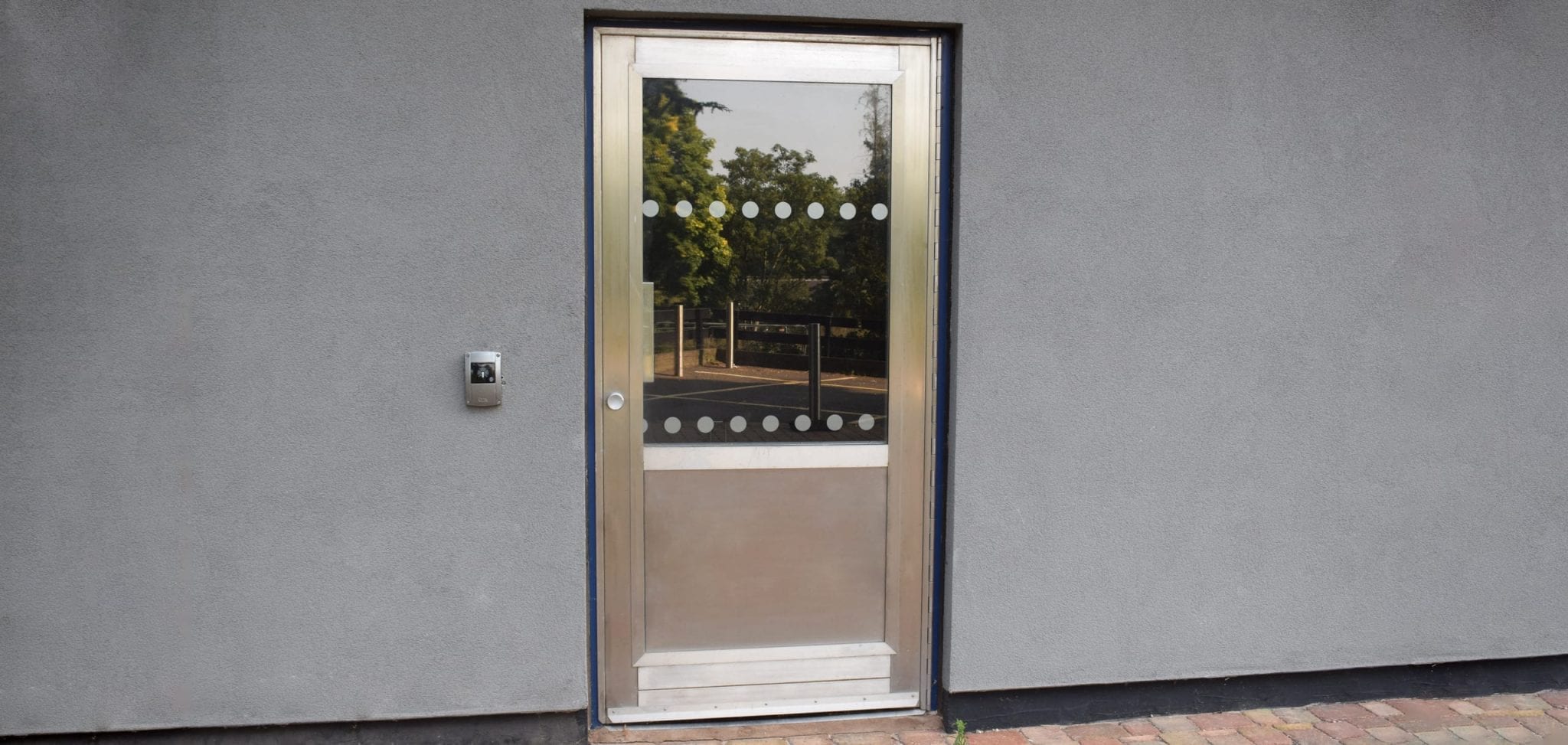 Warrior Bike Store Door with fully glazed top vision panel and stainless-steel anti-scuff bottom panel