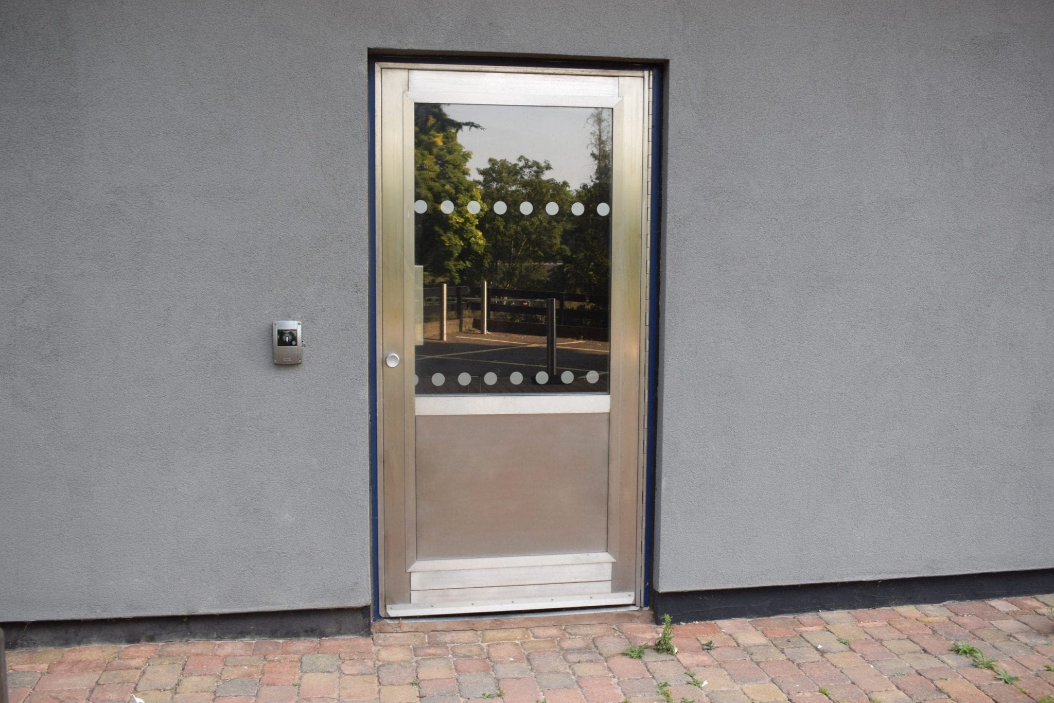 Warrior Bike Store Door with fully glazed top vision panel and stainless-steel anti-scuff bottom panel
