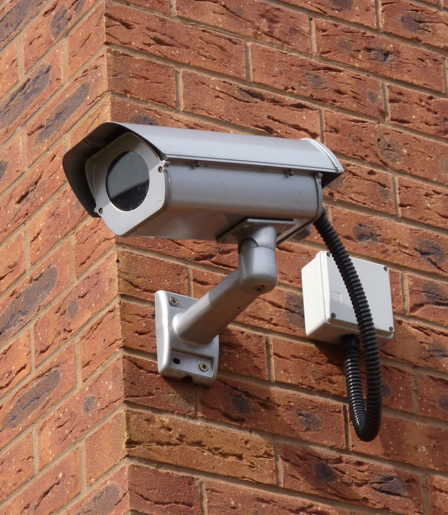 cctv camera installed on brick wall