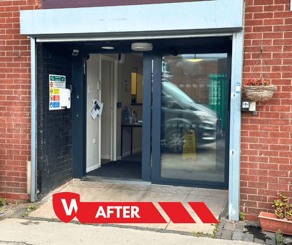Automatic sliding communal entrance — stainless-steel frame and glazed panels at Auckland Hall, Solihull